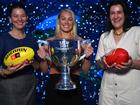 Launching the AFLW finals series are (from left) Emma Moore, Erin Phillips and Laura Kane.  (James Ross/AAP PHOTOS)