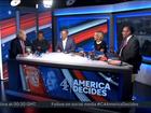 Boris Johnson holds up his book 'Unleashed' during an appearance on a panel during Channel 4's live coverage of the US election.