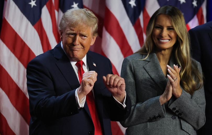 Republican presidential nominee and former U.S. President Donald Trump dances accompanied by Melania Trump, after speaking following early results from the 2024 U.S. presidential election in Palm Beach County Convention Center, in West Palm Beach, Florida, U.S., November 6, 2024. REUTERS/Carlos Barria