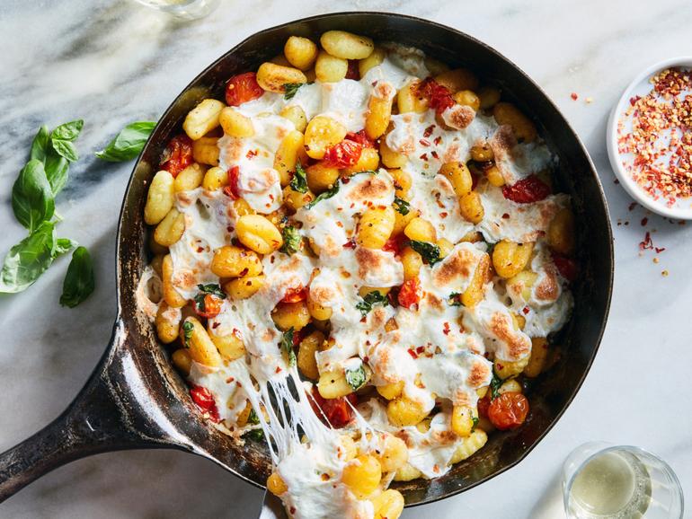 Crispy Gnocchi With Burst Tomatoes and Mozzarella. This recipe puts store-bought gnocchi to good use, browning it in a pan for a mix of crispy outsides and chewy middles. Food Stylist: Monica Pierini. (Linda Xiao/The New York Times)