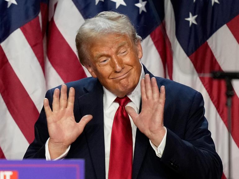 Republican presidential nominee former President Donald Trump dances after speaking at an election night watch party. 