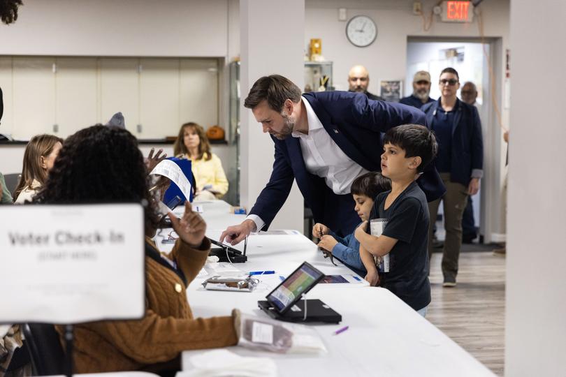 Sen. JD Vance (R-Ohio), the Republican nominee for vice president, is accompanied by his sons Ewan, right, and Vivek as he checks in to vote at his local polling place in Cincinnati on Election Day, Tuesday, Nov. 5, 2024. 