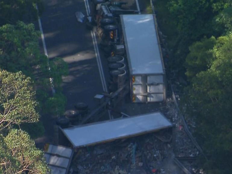 Two people have been killed, and six people have been injured in a two-truck crash at Tregony.