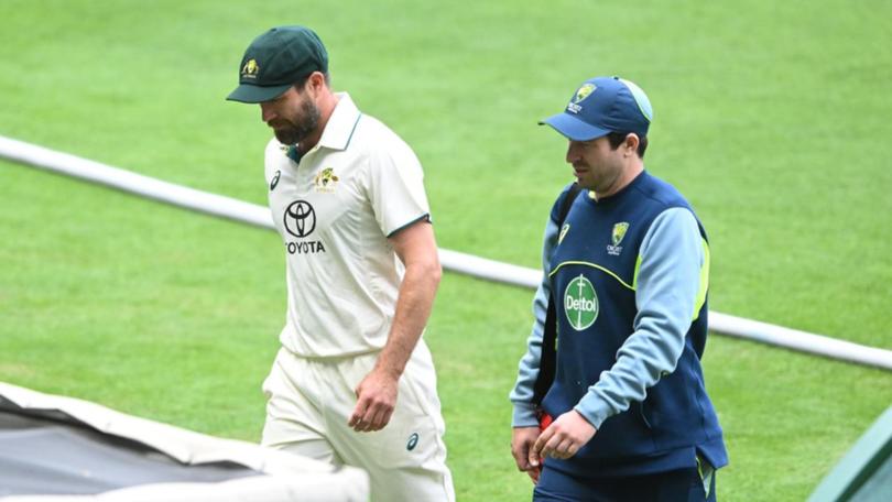 A hobbling Michael Neser leaves the field mid-over after wreaking havoc against India A. (James Ross/AAP PHOTOS)