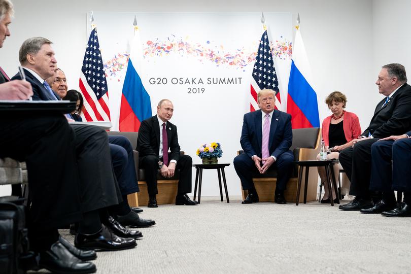 Then-President Donald Trump, right, meets with President Vladimir Putin of Russia at the G20 Summit in Osaka, Japan, June 28, 2019. 