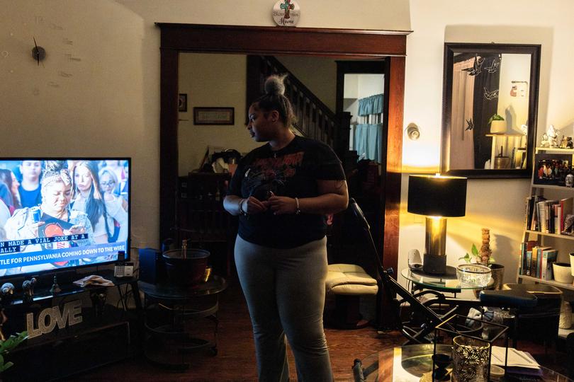 First-time voter Selena Greene watches election coverage at home. Greene cast her ballot for Kamala Harris.