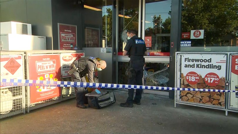 Police at one of the service stations on Friday morning.