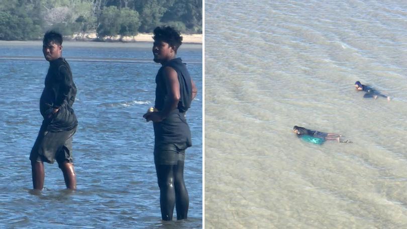 Incredible photos taken on Thursday afternoon show Indonesian fishermen swimming through shallow, croc-infested waters at West Arnhem Land in the Northern Territory to collect sea cucumbers.