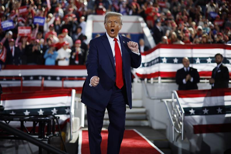 RALEIGH, NORTH CAROLINA - NOVEMBER 04: Republican presidential nominee, former President Donald Trump dances off stage at the conclusion of a campaign rally at the J.S. Dorton Arena on November 04, 2024 in Raleigh, North Carolina. With one day left before the general election, Trump is campaigning for re-election in the battleground states of North Carolina, Pennsylvania and Michigan. (Photo by Chip Somodevilla/Getty Images)