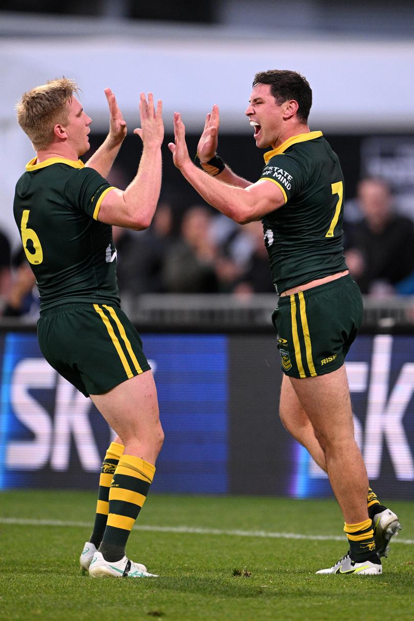 CHRISTCHURCH, NEW ZEALAND - OCTOBER 27: Mitchell Moses celebrates with Tom Dearden of Australia after scoring a try during the men's 2024 Rugby League Pacific Championships match between New Zealand Kiwis and Australian Kangaroos at Apollo Projects Stadium on October 27, 2024 in Christchurch, New Zealand. (Photo by Joe Allison/Getty Images)