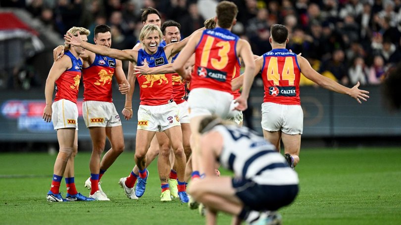 Lions celebrate their win over Geelong in the preliminary final.