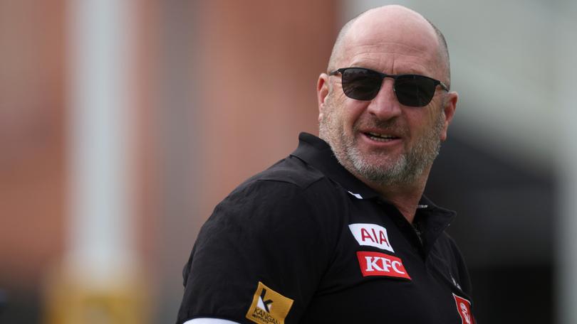 An out-of-court settlement has been reached between Collingwood and a former First Nations strategist who accused club CEO Craig Kelly of a series of racial slurs and attacks.