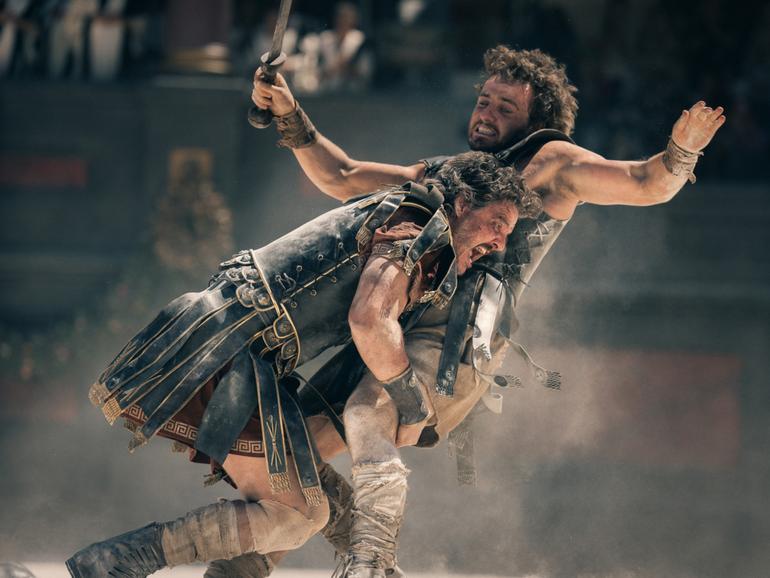 Pedro Pascal and Paul Mescal clash in a bloody Colosseum battle in Gladiator II.