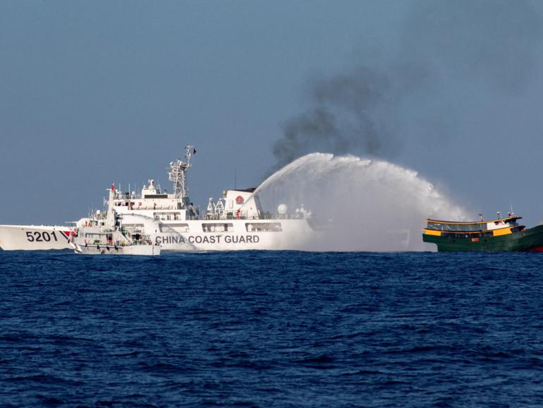 Chinese Coast Guard vessels fire water cannons towards a Philippine resupply vessel Unaizah May 4. 