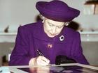 A file image of Queen Elizabeth writing. She always signed off as ‘Elizabeth R.’