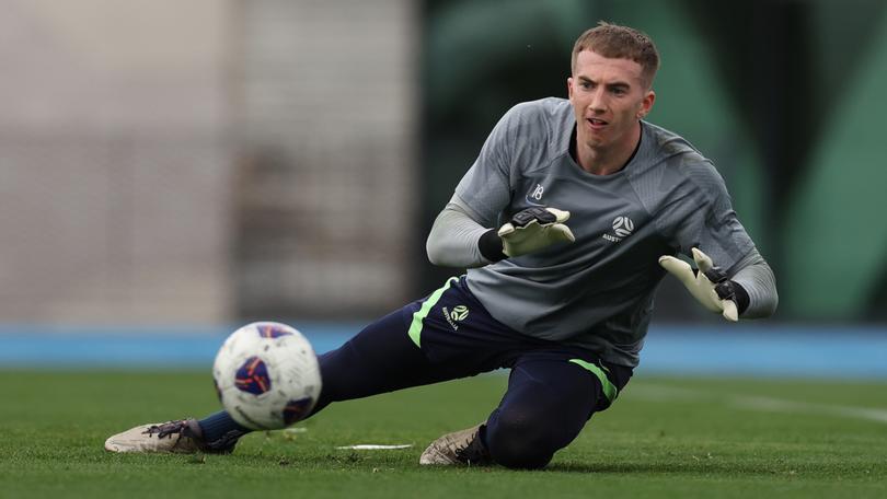 Socceroo goalkeeper Joe Gauci makes a save during a Socceroos training session at Lakeside Stadium in Melbourne.