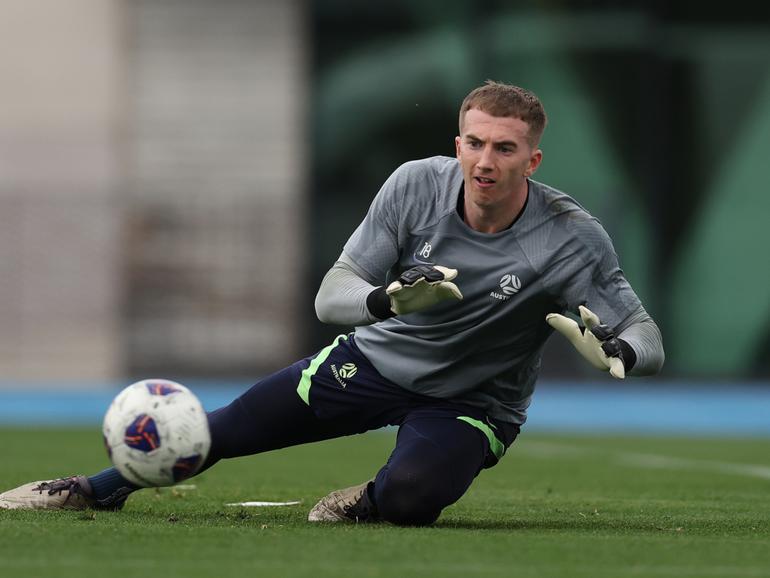 Socceroo goalkeeper Joe Gauci makes a save during a Socceroos training session at Lakeside Stadium in Melbourne.