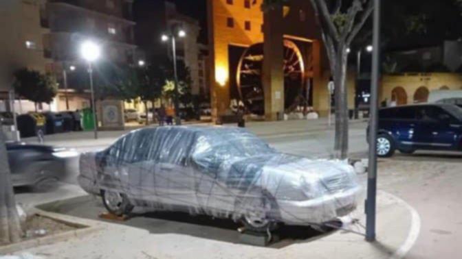 Residents in Spain are tying down their cars in preparation for ongoing storms.