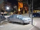 Residents in Spain are tying down their cars in preparation for ongoing storms.