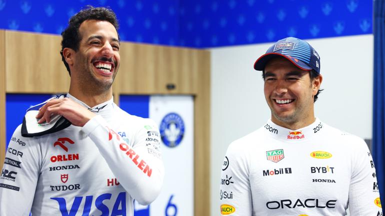 Sergio Perez (right) has spoken out about his decision to stay at Red Bull.