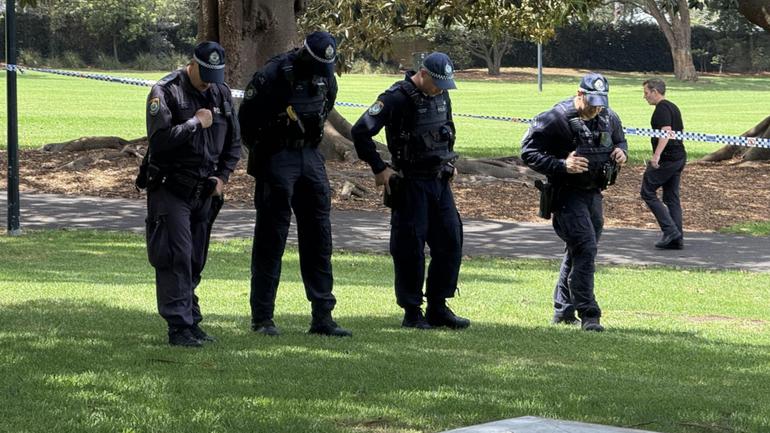 Police conduct a search behind NSW Parliament House after a man allegedly let off a gelblaster. 