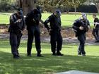 Police conduct a search behind NSW Parliament House after a man allegedly let off a gelblaster. 