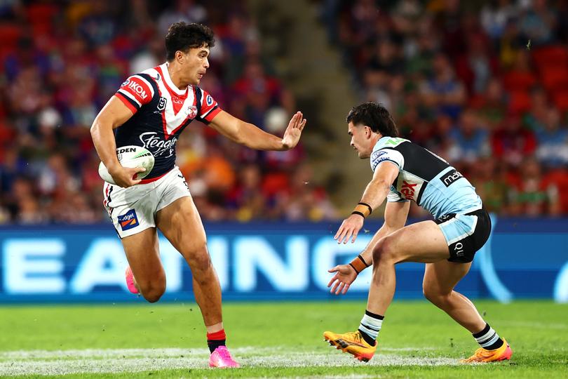 BRISBANE, AUSTRALIA - MAY 18: Joseph-Aukuso Suaalii of the Roosters runs the ball  during the round 11 NRL match between Cronulla Sharks and Sydney Roosters at Suncorp Stadium, on May 18, 2024, in Brisbane, Australia. (Photo by Chris Hyde/Getty Images)