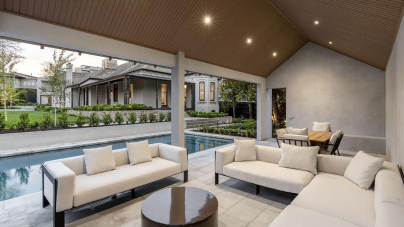 The Toorak luxury property features a stunning pool and outdoor area.