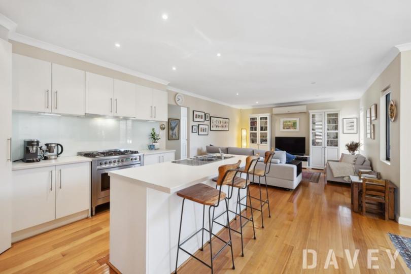 This WA home features a large open-plan family, dining and kitchen space.