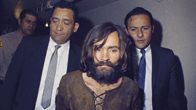 Charles Manson is escorted to his arraignment on conspiracy-murder charges in connection with the Sharon Tate murder case in Los Angeles in 1969.