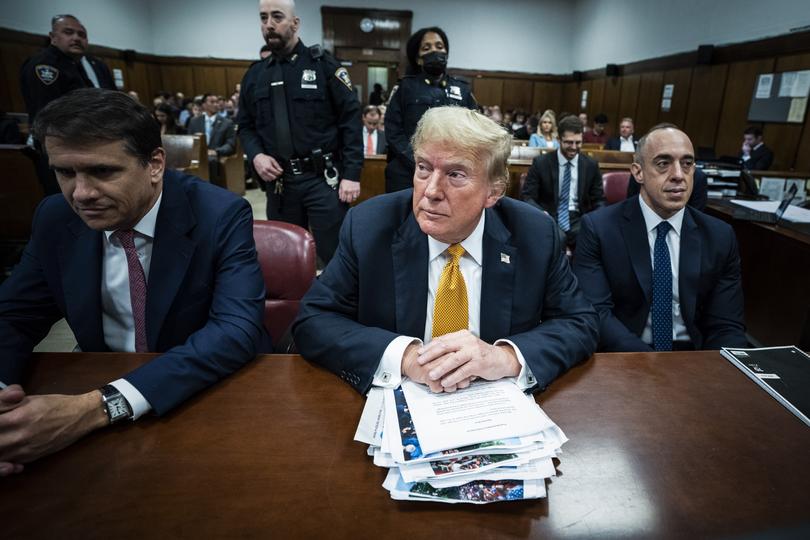 Trump, flanked by attorneys Todd Blanche and Emil Bove, arrives for his criminal trial in New York in May. 