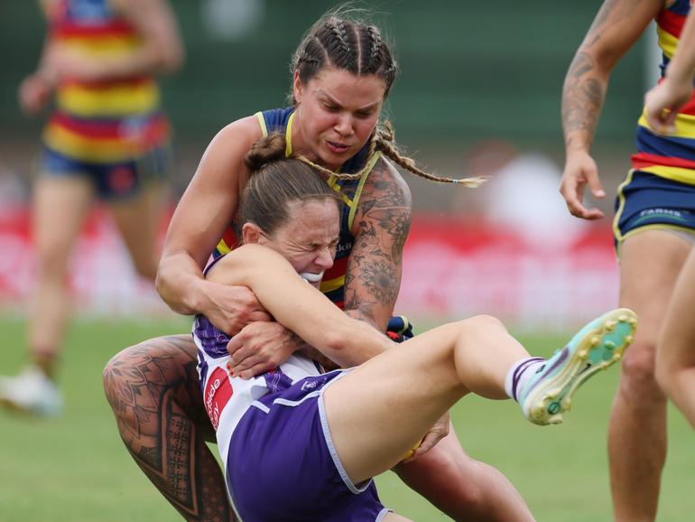 Anne Hatchard of the Crows tackles Freo’s Megan Kauffman.