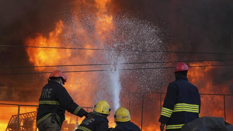 A hospital ward in Uttar Pradesh state was well ablaze when firefighters arrived.