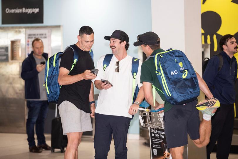 Scott Boland, Alex Carey and Travis Head arrive.