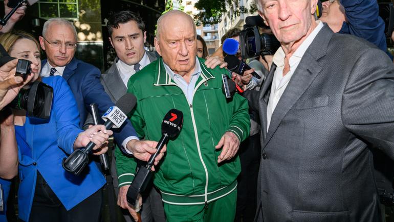 Alan Jones (centre) departs the Day St Police Station, in Sydney, Monday, November 18, 2024. Veteran radio broadcaster Alan Jones, 83, has been arrested over indecent assault and sexual touching allegations spanning two decades. (AAP Image/Bianca De Marchi) NO ARCHIVING