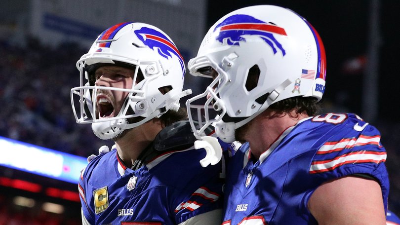 Josh Allen #17 celebrates his rushing touchdown with teammate Dawson Knox.