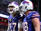 Josh Allen #17 celebrates his rushing touchdown with teammate Dawson Knox.