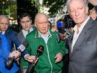 Alan Jones was silent when he left a police station on Monday after being charged with 24 offences.