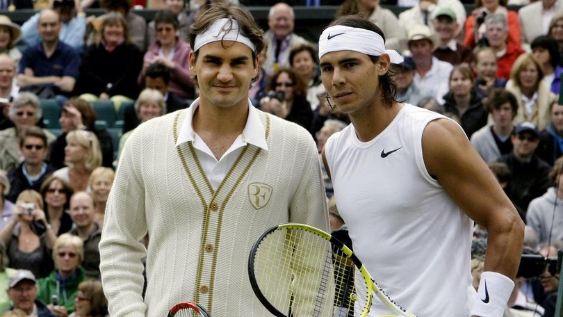 Roger Federer (l) and Rafa Nadal (r) pose before the start of the Wimbledon men's final in 2008.