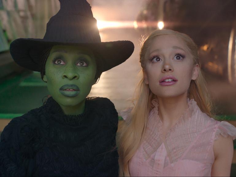 L to R: Cynthia Erivo is Elphaba and Ariana Grande is Glinda in WICKED, directed by Jon M. Chu