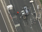 A serious crash on a major Melbourne freeway is causing long traffic delays, including for those hearing to the airport.