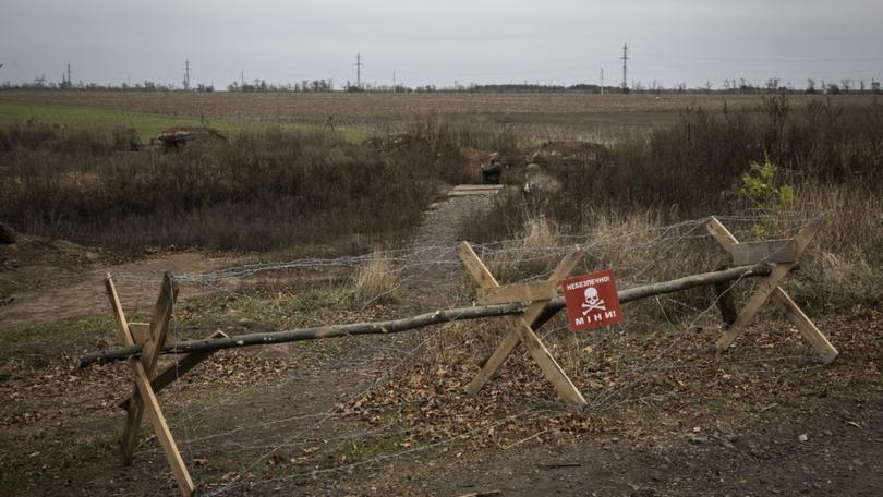 A sign warns of land mines in Ukraine's Kherson region in 2023. 