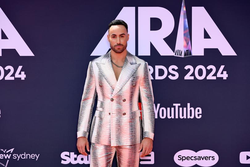 Matty Mills attends the red carpet during the 38th ARIA Music Awards.