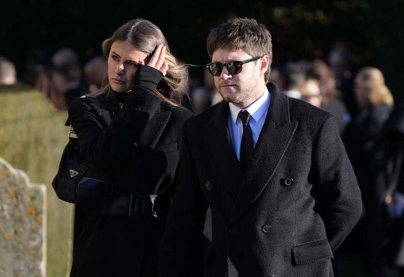 Niall Horan was supported by his girlfriend at the funeral.