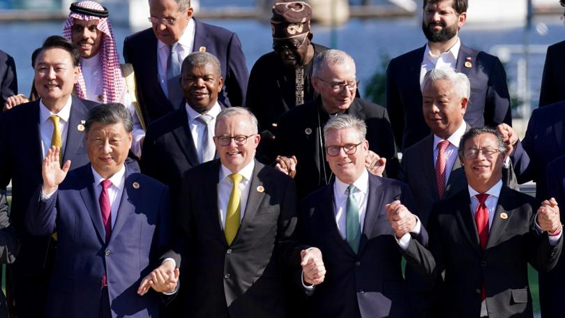 RIO DE JANEIRO, BRAZIL - NOVEMBER 18: (L-R front row) Chinese Prime Minister Xi Jinping, Australian Prime Minister Anthony Albanese, UK Prime Minister Sir Keir Starmer and Colombian President Gustavo Petro with leaders of the G20 members as they pose for the photo of the Global Alliance Against Hunger and Poverty at the G20 summit at the Museum of Modern Art on November 18, 2024 in Rio de Janeiro, Brazil. Keir Starmer is attending his first G20 Summit since he was elected Prime Minister of the UK. He is expected to hold talks with President Xi Jinping of China, the first time a UK PM has done so for six years. (Photo by Stefan Rousseau - WPA Pool/Getty Images)