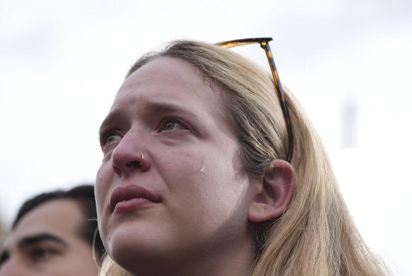 A supporter listens as Harris delivers her concession speech. 