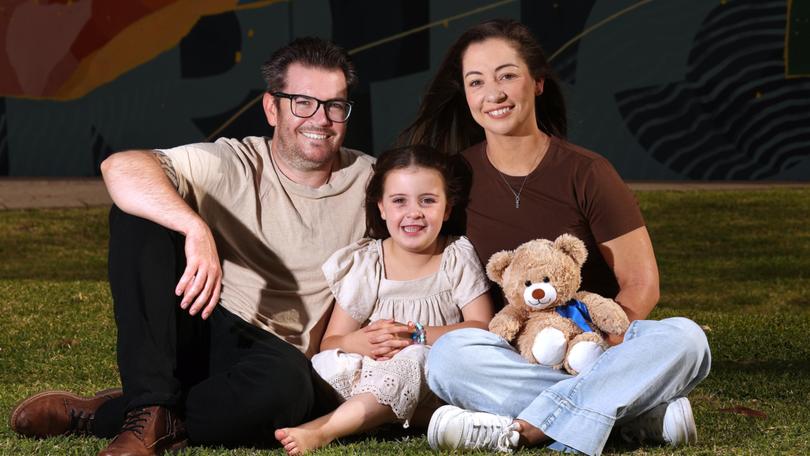 Parents Tyler and Kelly Binnington with their daughter Ella at the Harry Perkins Institute of Medical Research. 