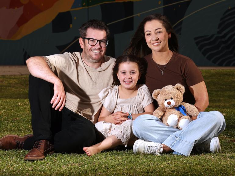 Parents Tyler and Kelly Binnington with their daughter Ella at the Harry Perkins Institute of Medical Research. 