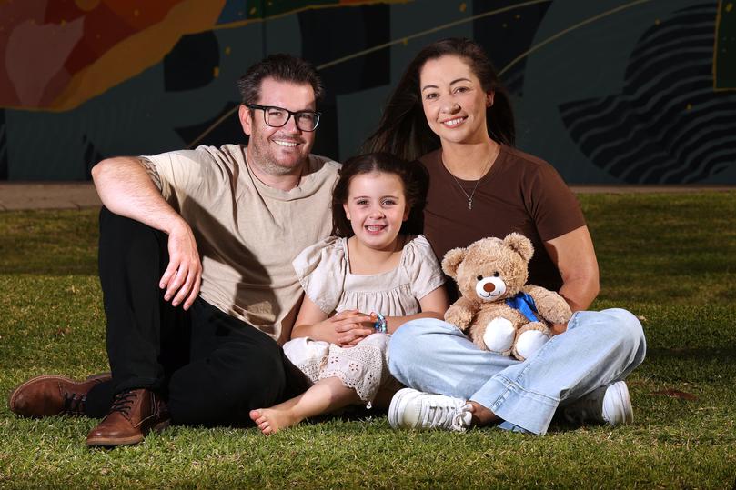 Parents Tyler and Kelly Binnington with their daughter Ella, 5, outside the Harry Perkins Institute of Medical Research.