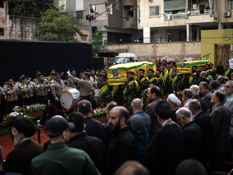 Mourners walk with a coffin during a funeral for four people killed in the pager attack, in Beirut, on Wednesday, September 18, 2024.